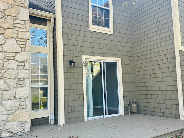 doorway to property featuring a wooden deck