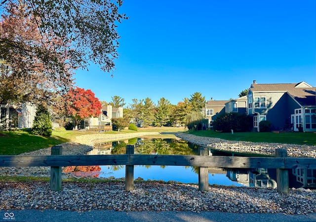 view of property's community with a lawn