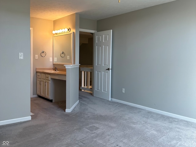 bathroom with vanity and a textured ceiling