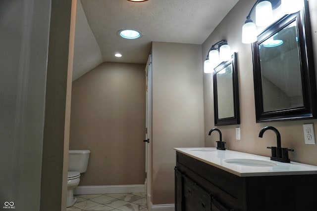 201 W Walnut St, Waldron, IN 46182 - bathroom featuring marble look tile flooring, double vanity, recessed lighting, and a textured ceiling