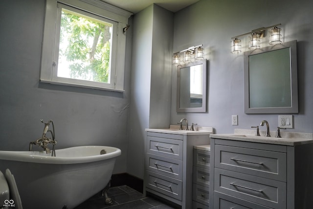 201 W Walnut St, Waldron, IN 46182 - bathroom with two vanities, a soaking tub, and tile patterned flooring