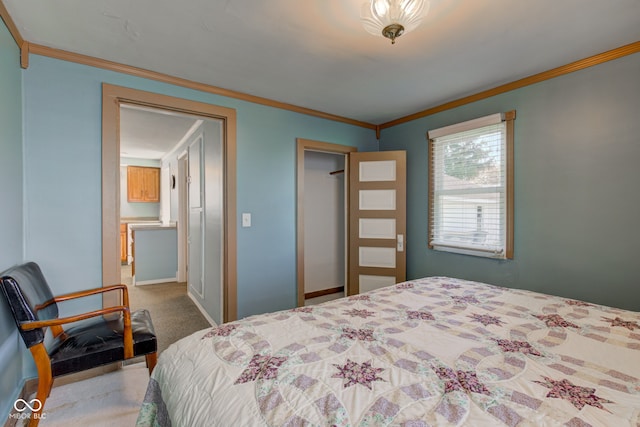 bedroom with crown molding and carpet