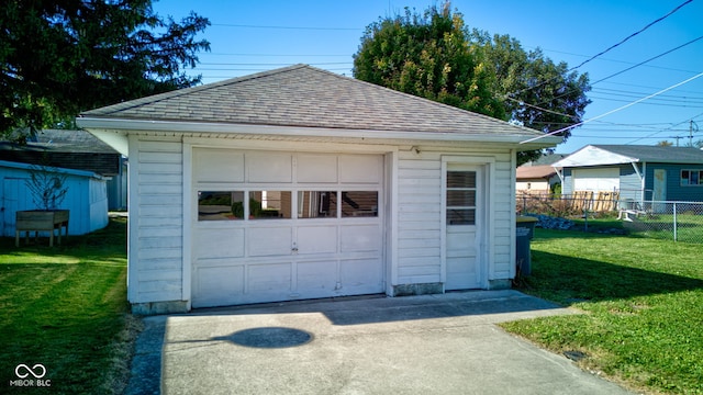 garage with a yard