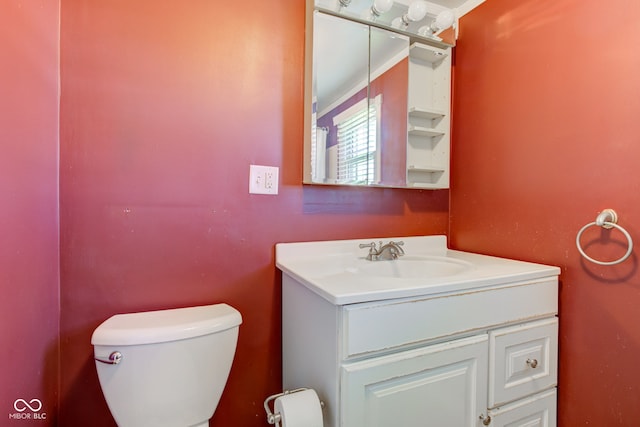 bathroom with toilet and vanity