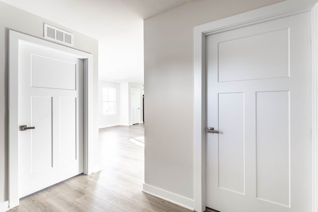 hallway featuring light hardwood / wood-style flooring