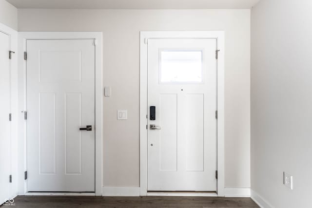 entrance foyer with dark hardwood / wood-style flooring