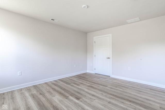 unfurnished room with light hardwood / wood-style floors