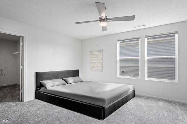 802 Weldon Way, Westfield, IN 46074 - carpeted bedroom with a walk in closet and ceiling fan