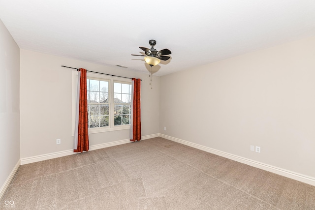 carpeted empty room with ceiling fan