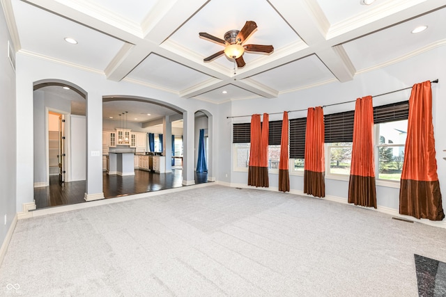 unfurnished room featuring carpet flooring, ceiling fan, crown molding, and coffered ceiling