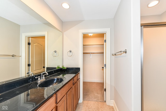 bathroom featuring tile patterned floors and vanity