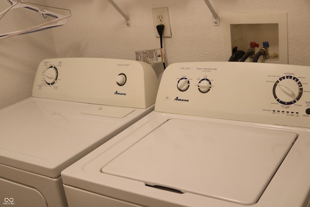 washroom featuring independent washer and dryer