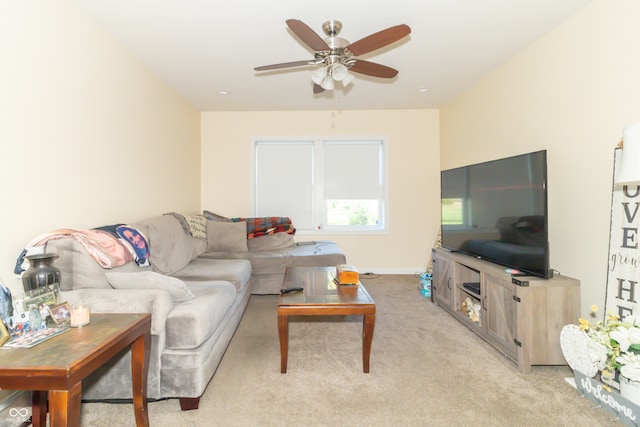 living room with light colored carpet and ceiling fan