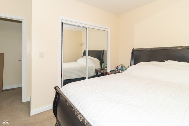 carpeted bedroom featuring a closet