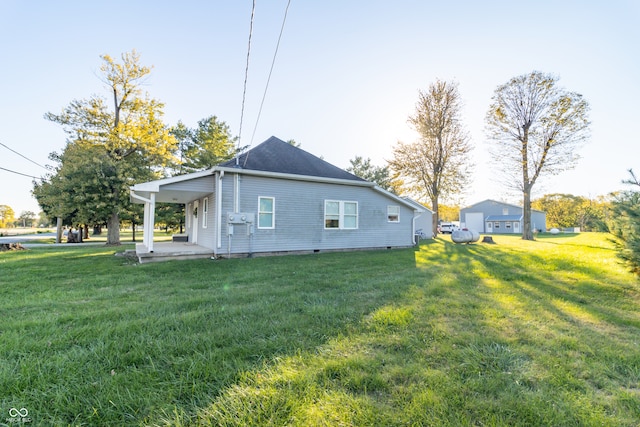 view of side of home featuring a yard