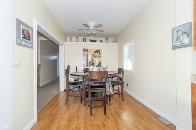 dining area featuring light hardwood / wood-style floors and ceiling fan