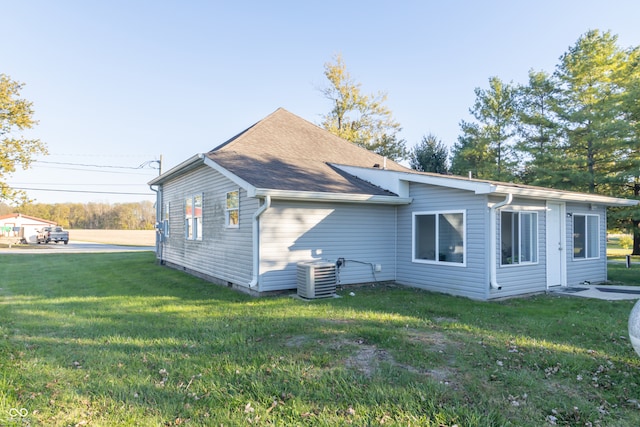 view of home's exterior featuring a yard and cooling unit