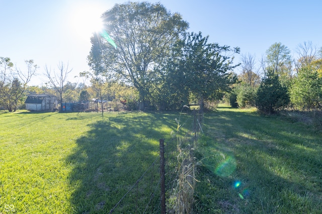 view of yard with a rural view