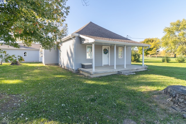 view of front of house with a front lawn and a porch