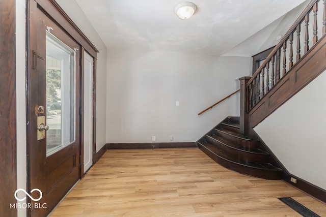 entryway with light hardwood / wood-style flooring