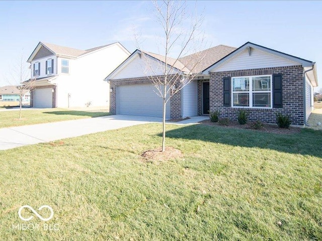 view of front of property featuring a front yard and a garage