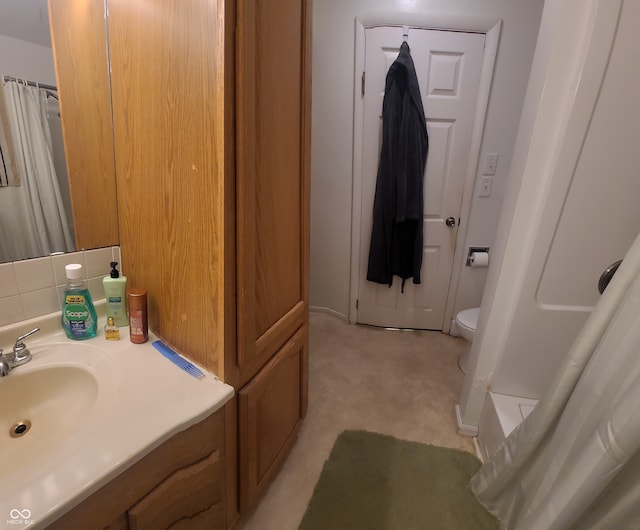 bathroom with vanity, walk in shower, and toilet