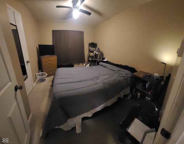 bedroom featuring light colored carpet and ceiling fan