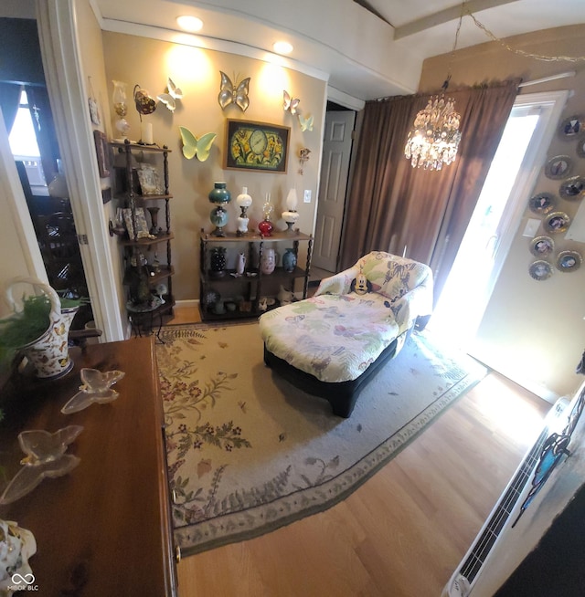 living area featuring wood finished floors and a notable chandelier