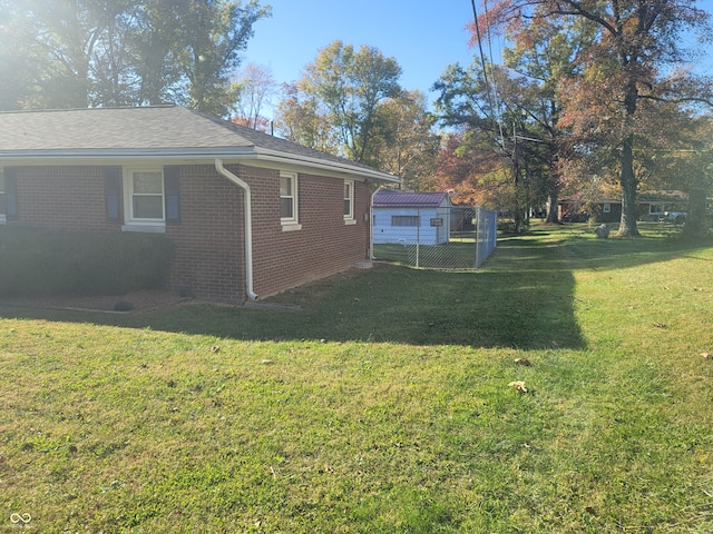 view of side of home featuring a lawn