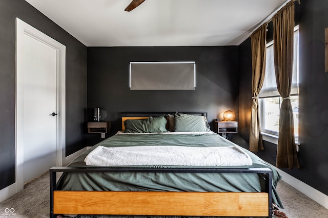 bedroom with ceiling fan and carpet floors