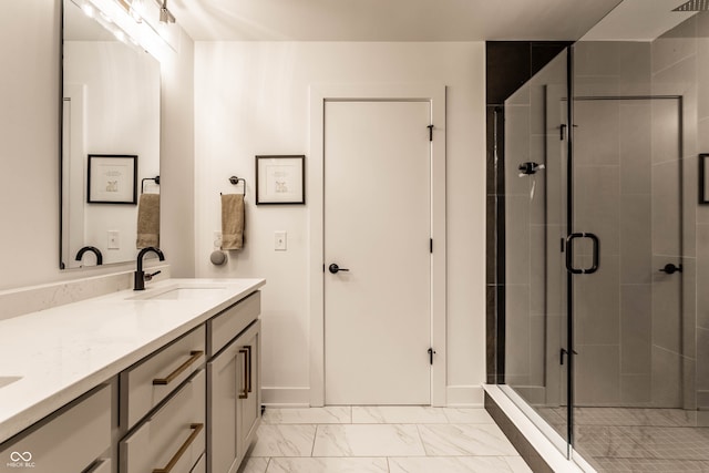 bathroom with vanity and a shower with shower door