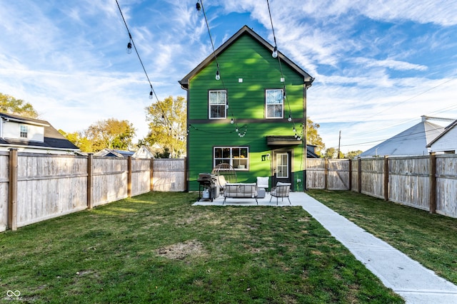 rear view of house with a yard, a patio area, and outdoor lounge area