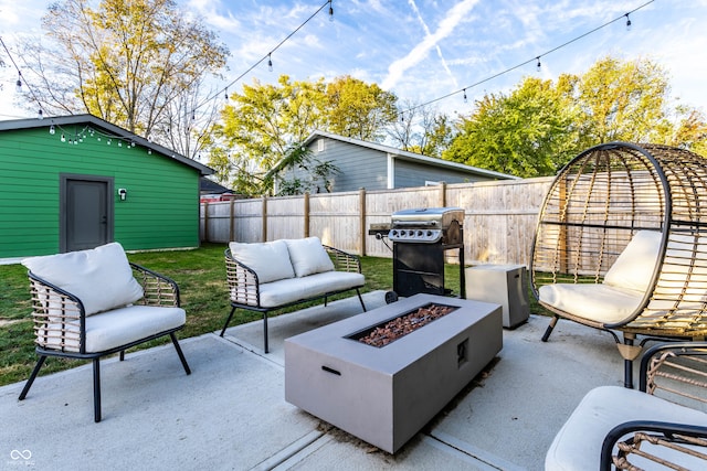 view of patio / terrace with an outdoor living space with a fire pit and grilling area