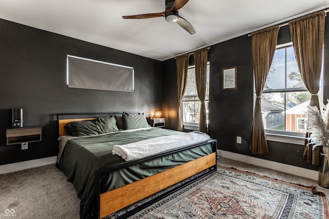 carpeted bedroom featuring ceiling fan