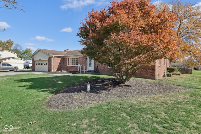 view of front facade featuring a garage and a front lawn