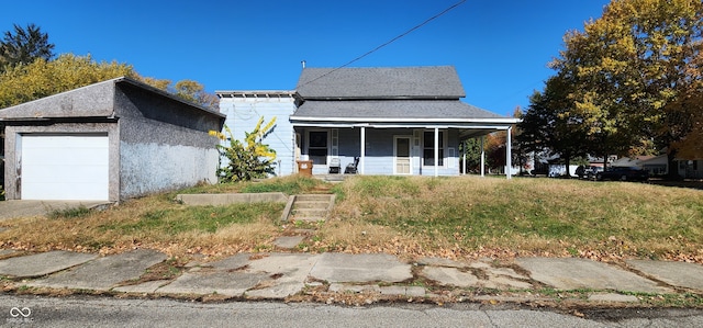 view of front facade featuring covered porch and a garage