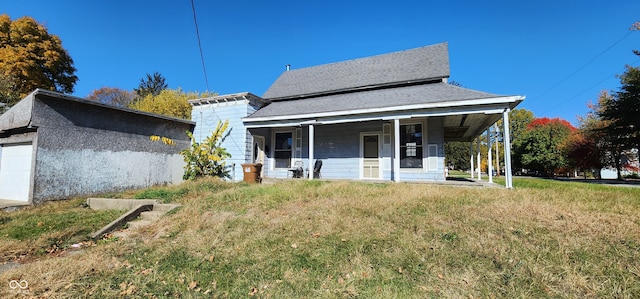 view of front of house with a porch and a front lawn