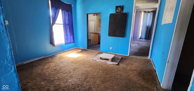 unfurnished room featuring carpet floors