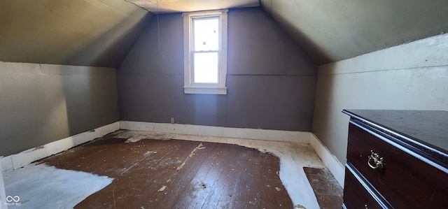 additional living space featuring vaulted ceiling