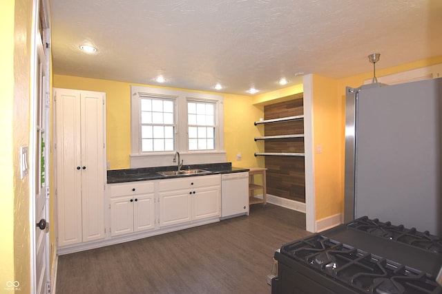 kitchen featuring dark hardwood / wood-style flooring, black gas range oven, white dishwasher, sink, and stainless steel refrigerator