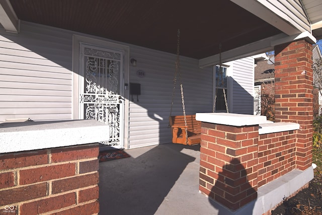 doorway to property with covered porch