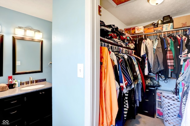 walk in closet featuring sink