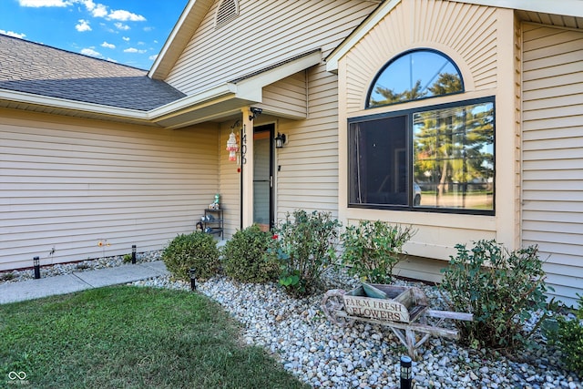 entrance to property with a yard