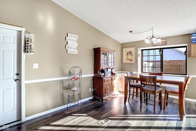 dining area with dark hardwood / wood-style flooring, high vaulted ceiling, a textured ceiling, and a notable chandelier