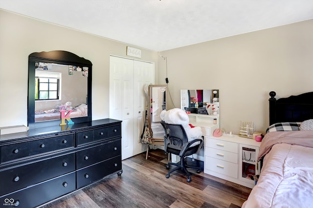 bedroom featuring dark hardwood / wood-style flooring and a closet