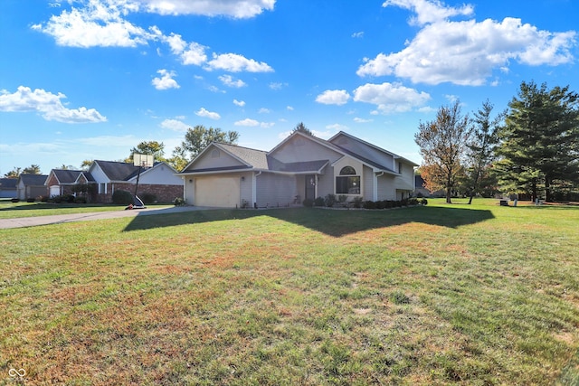 ranch-style house featuring a garage and a front yard