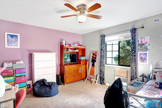 interior space featuring ceiling fan and carpet flooring