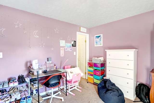 home office with a textured ceiling and light carpet