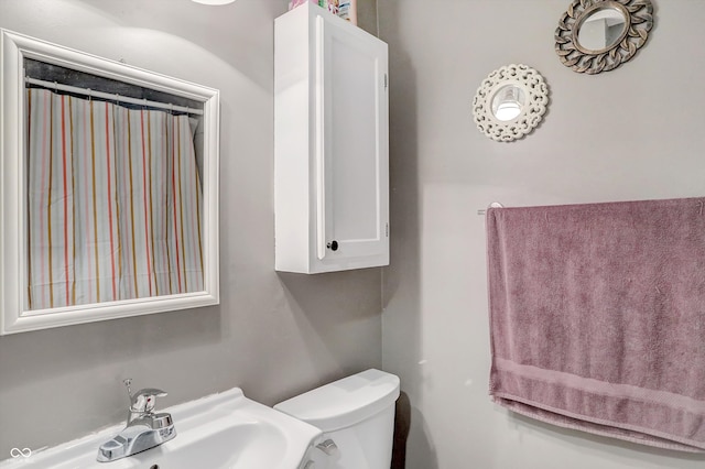 bathroom with sink and toilet