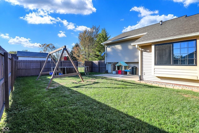 view of yard featuring a patio area and a playground